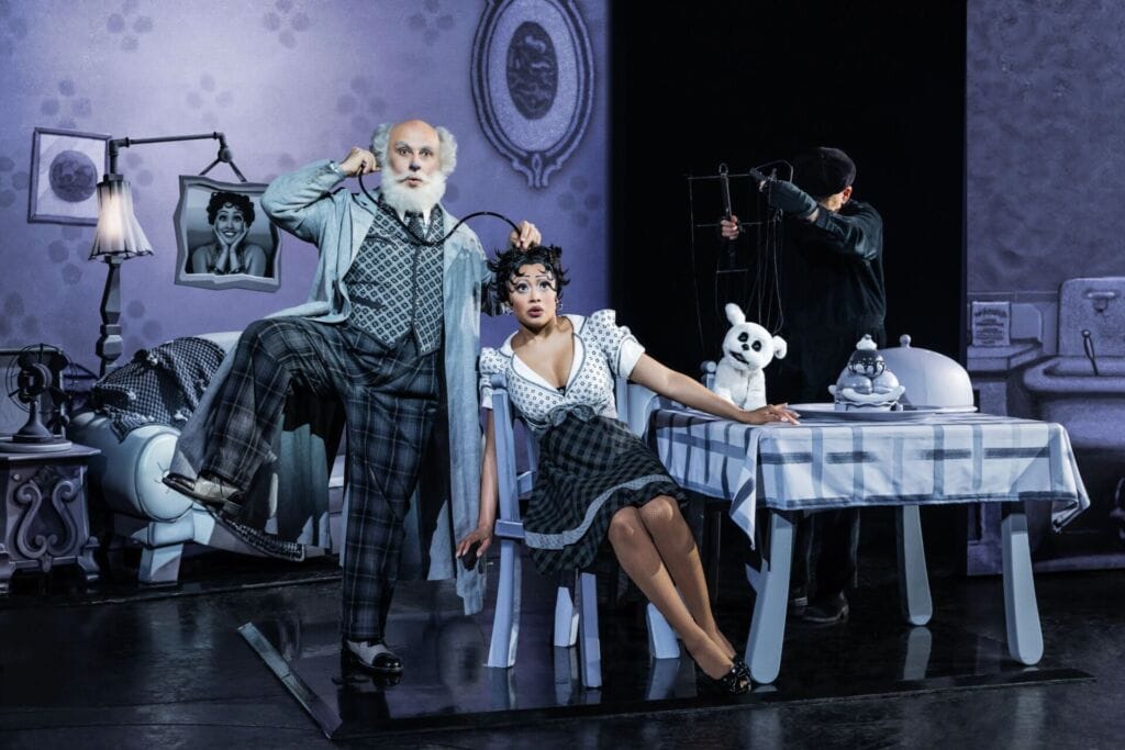 actors in black and white performing on stage