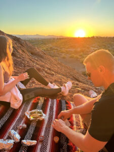 Taco picnic at Hole-in-the-Rock Trail at sunset.