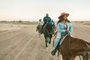 People horseback riding in Arizona desert