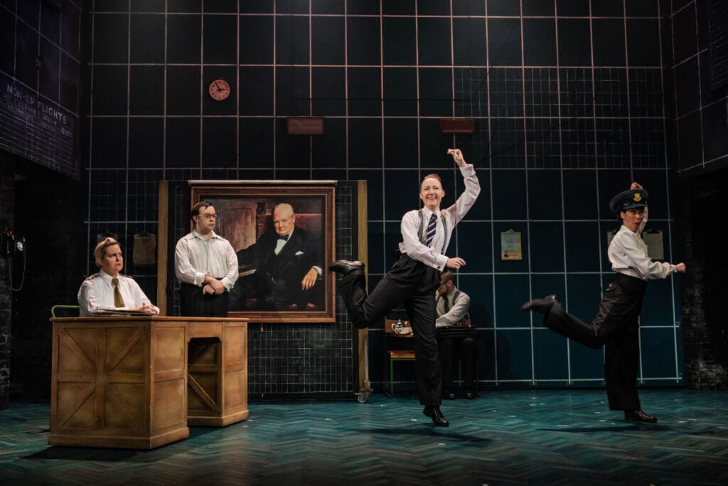 People performing on stage during musical