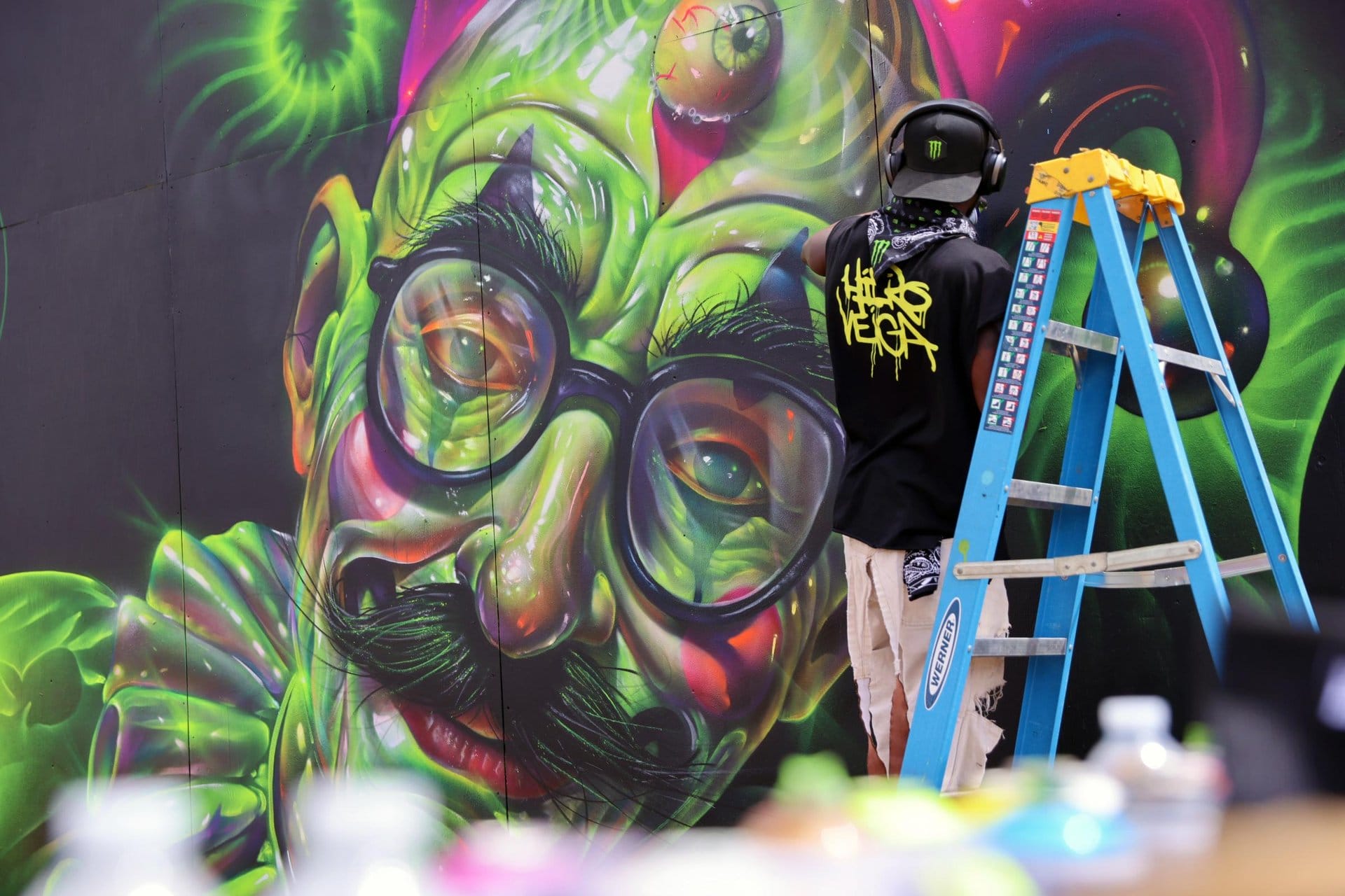 Live mural painting during Reggae Rise Up festival in Arizona.