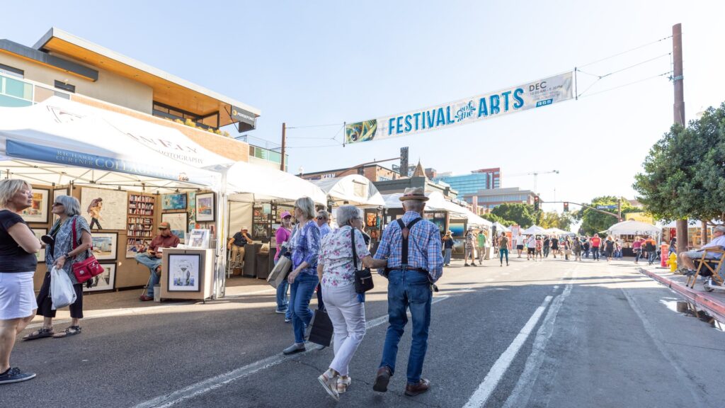 two couples walking on the streets at the Tempe Festival of the Arts