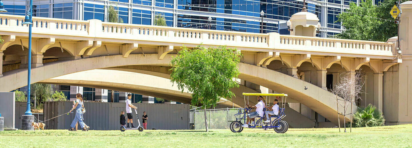 green grass, people walking and enjoying the outdoors